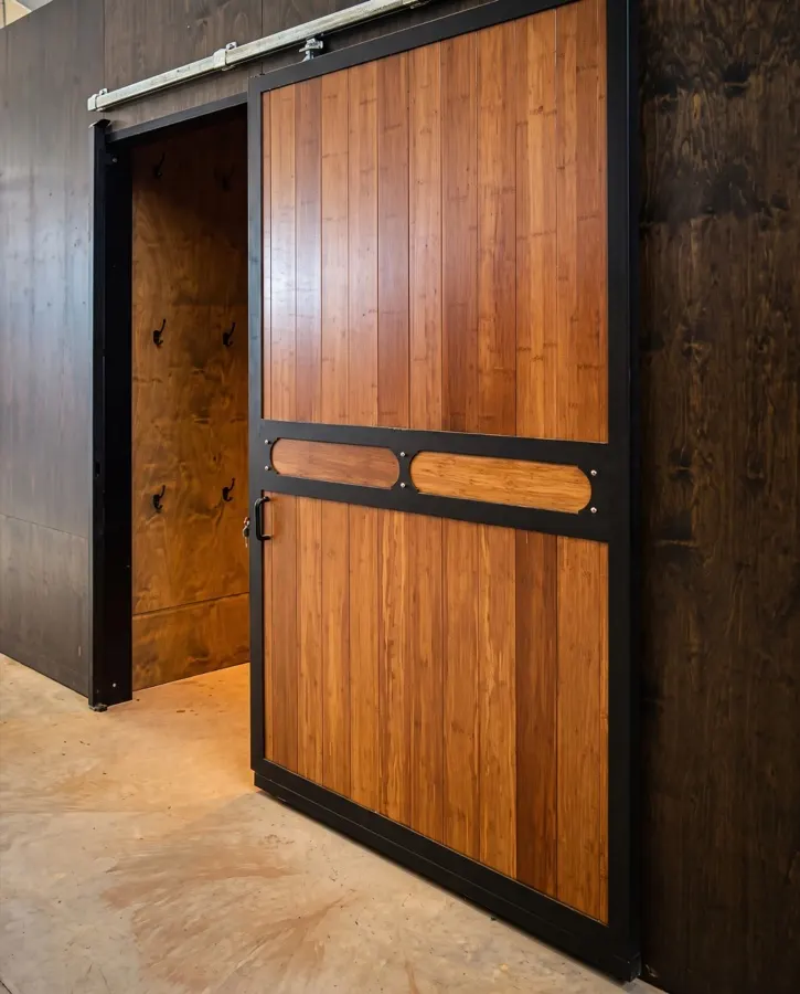 Timber sliding barn door on a black steel frame