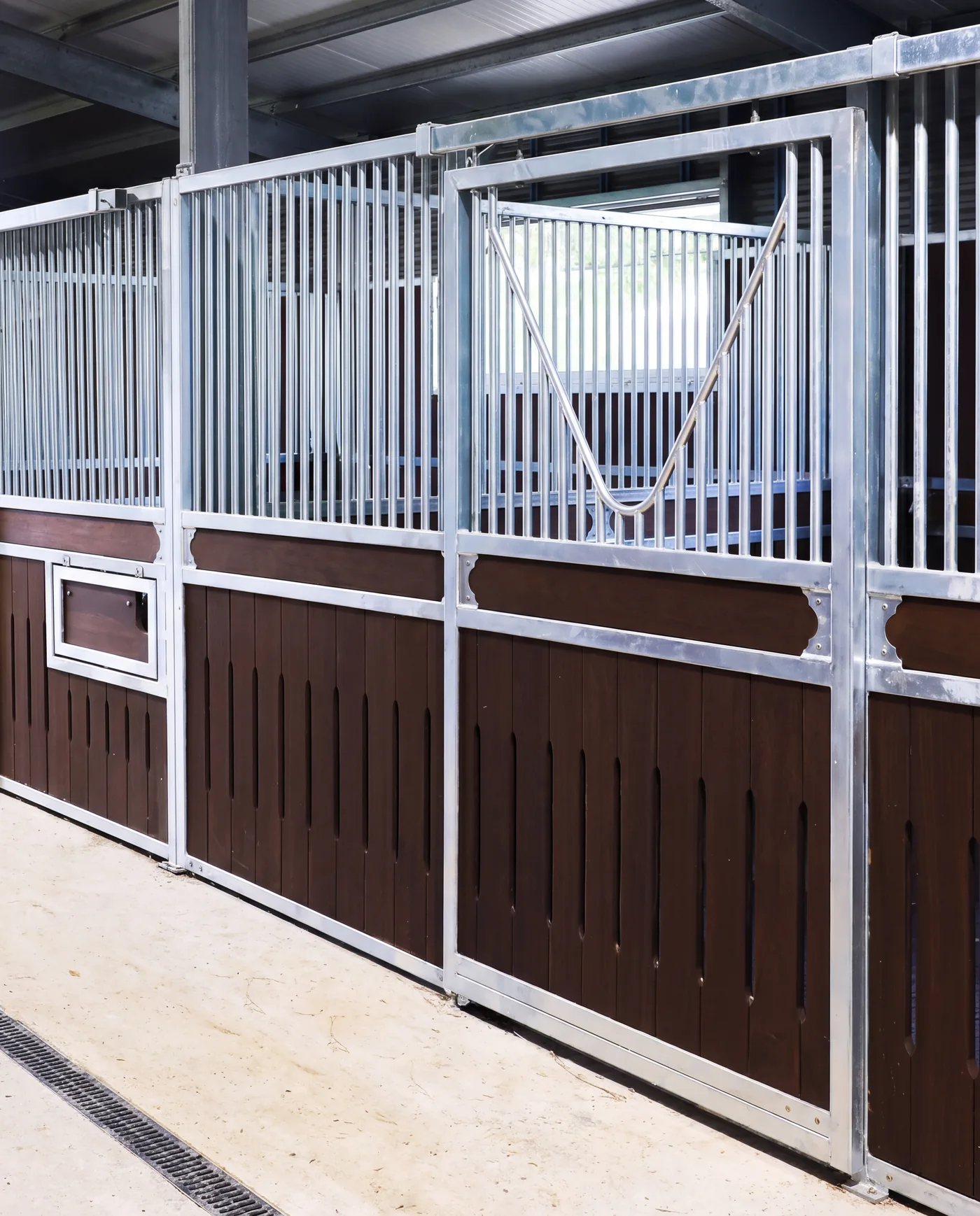 Galvanised stable front with sliding door and vented timber infill